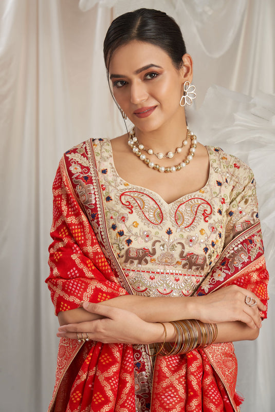 Flawless Tissue Thread Embroidery Cream And Red Lehenga Choli