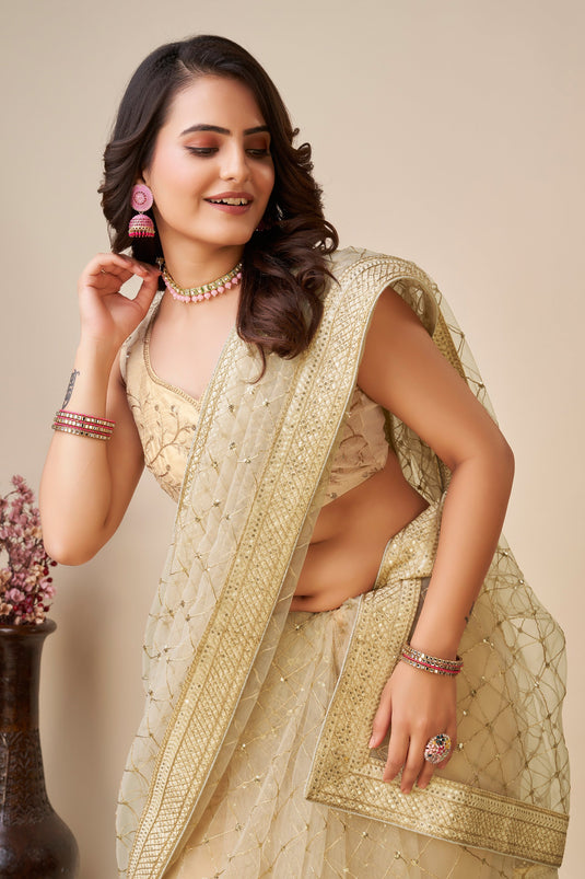 Cream Color Net Fabric Coveted Saree With Sequins Work