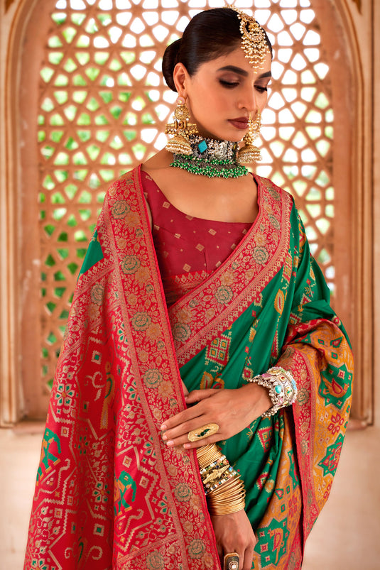 Beguiling Patola Weaving Work On Green Color Art Silk Fabric Saree
