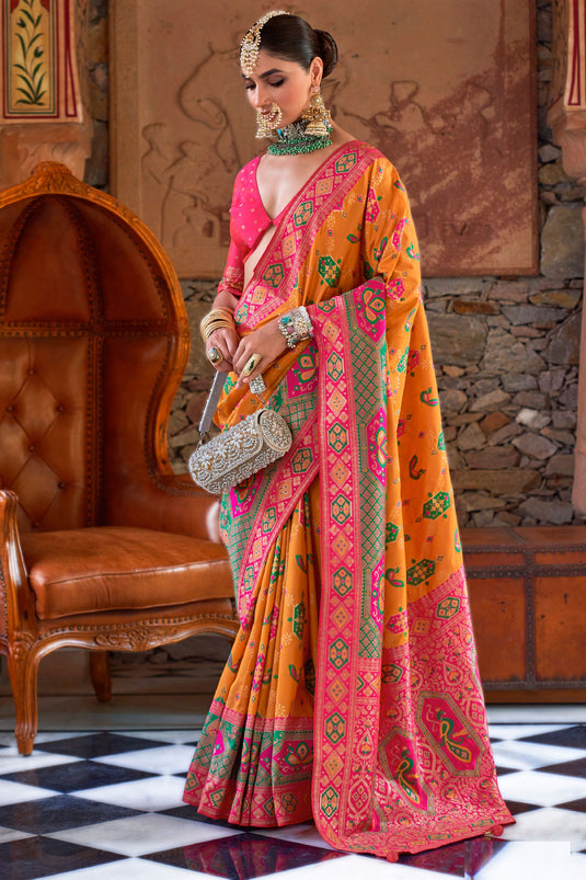 Art Silk Fabric Orange Color Saree With Winsome Patola Weaving Work