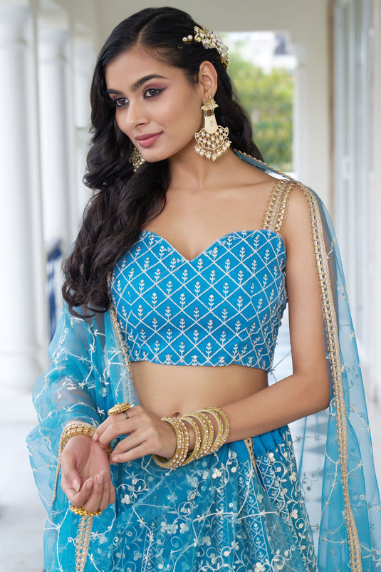 Sangeet Special Cyan Color Net Fabric Sequins Embroidered Lehenga