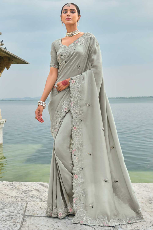 Banarasi Fabric Heavy Embroidered Work Mesmeric Saree In Grey Color