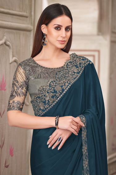 Teal Party Style Georgette Silk Charismatic Lace Border Work Saree With Embroidered Blouse