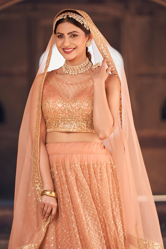 Peach Color Function Wear Net Fabric Incredible Lehenga