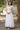 Fancy Fabric Luminous Readymade Long Gown In White Color