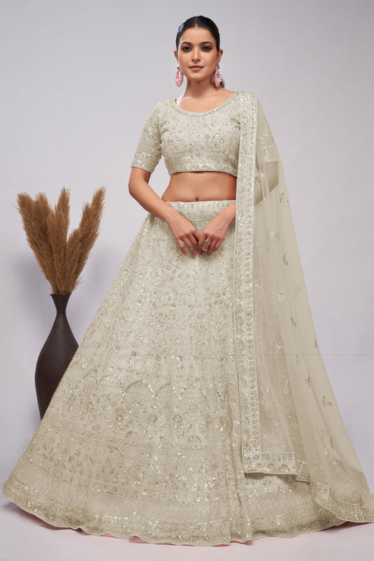 Soothing Sequins Work On Off White Color Net Fabric Lehenga