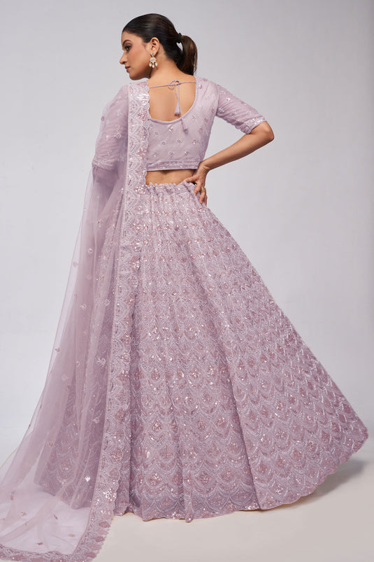 Tempting Net Fabric Lavender Color Lehenga With Sequins Work