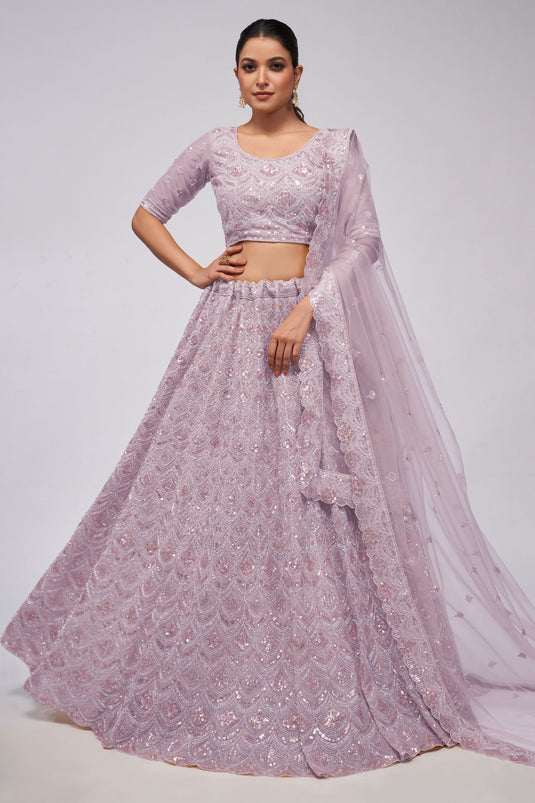 Tempting Net Fabric Lavender Color Lehenga With Sequins Work