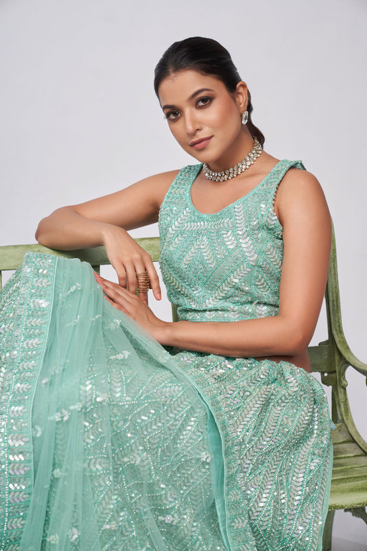 Amazing Sea Green Color Net Fabric Lehenga With Sequins Work