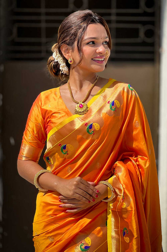 Weaving Work Imposing Paithani Silk Saree In Orange Color