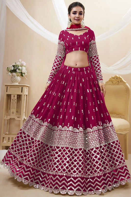 Tempting Georgette Fabric Rani Color Wedding Wear Lehenga Choli With Embroidered Work