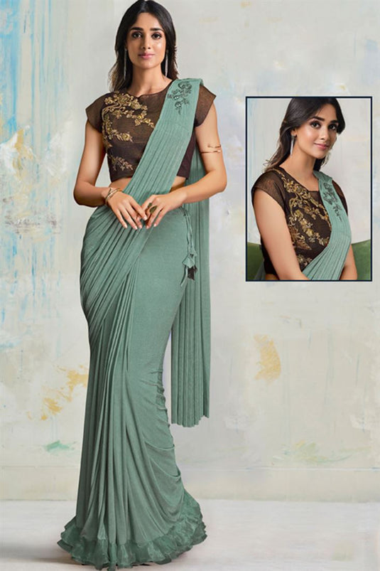Party Style Lovely Lycra Fabric Saree In Sea Green Color