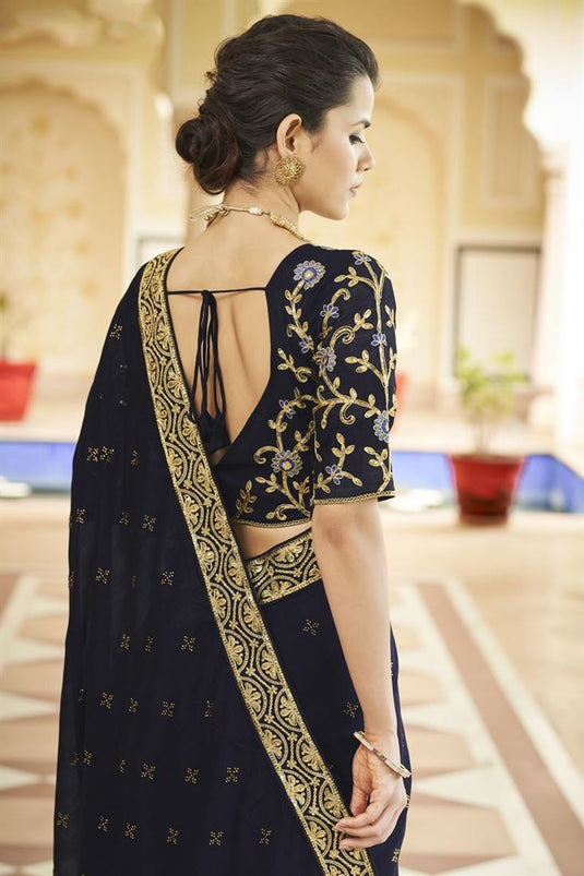 Border Work On Captivating Fancy Fabric Saree In Navy Blue Color