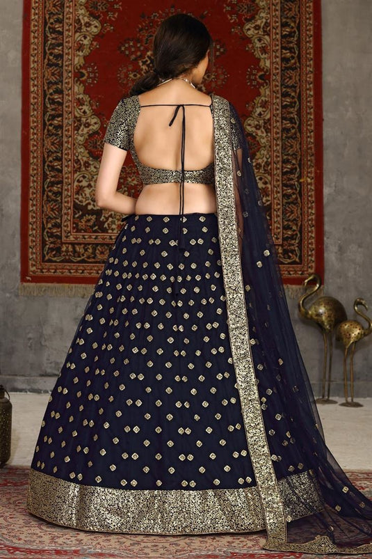 Net Fabric Sangeet Wear Navy Blue Color Sequins Work Lehenga Choli