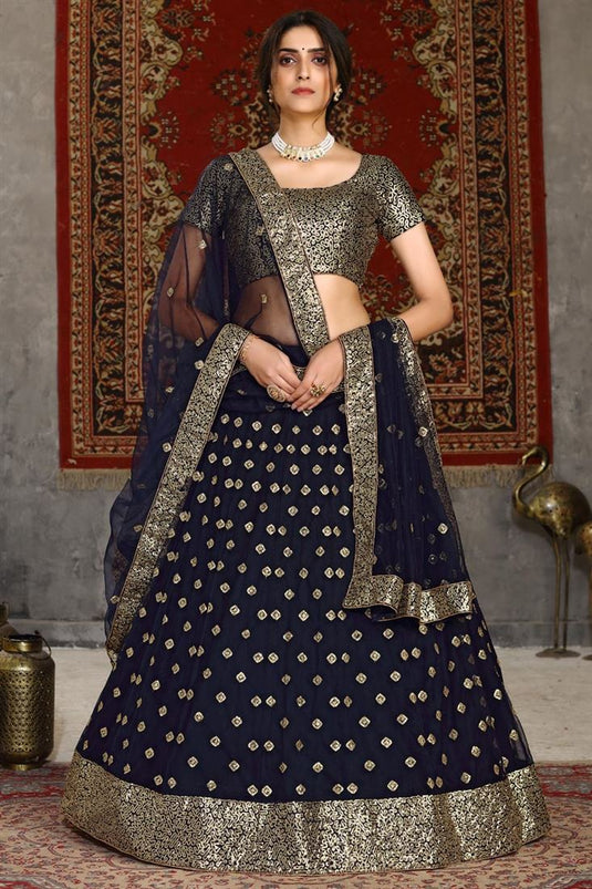 Net Fabric Sangeet Wear Navy Blue Color Sequins Work Lehenga Choli