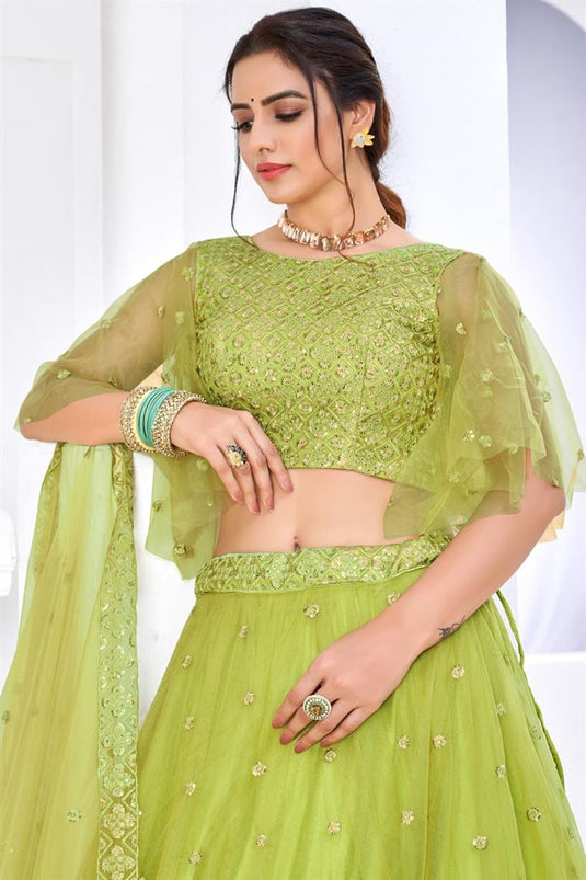 Pretty Net Fabric Embroidered Sangeet Wear Lehenga Choli In Green Color