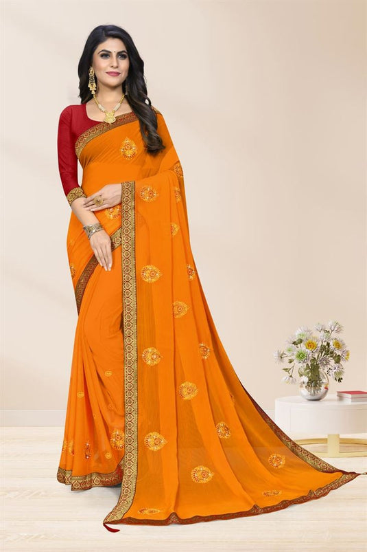 Chiffon Fabric Orange Color Casual Wear Embellished Saree