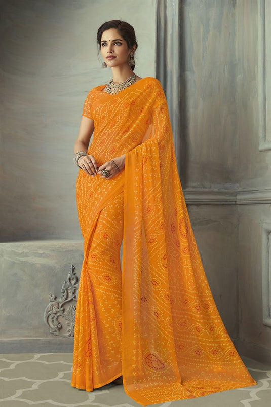 Festive Wear Fancy Bandhani Print Saree In Orange Color Chiffon Fabric