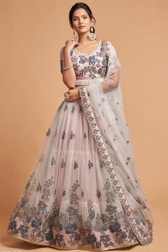 Sangeet Wear Net Fabric Patterned Peach Color Lehenga With Embroidered Work