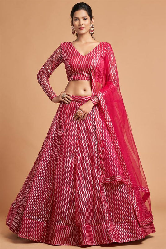 Coveted Embroidered Work On Rani Color Net Fabric Lehenga In Sangeet Wear