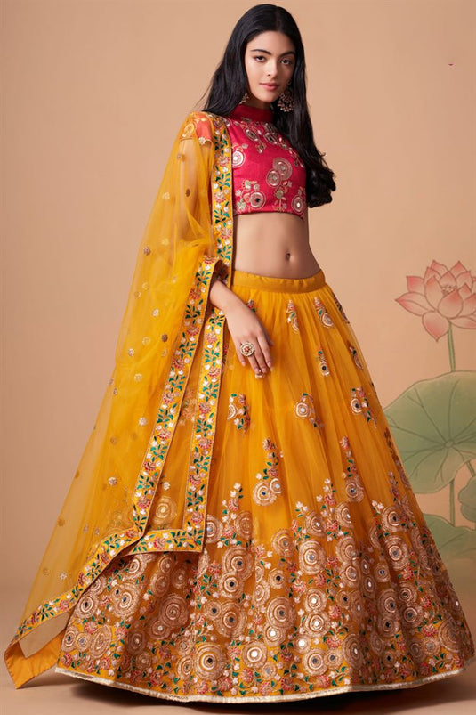 Tempting Net Fabric Yellow Color Lehenga Choli In Sangeet Wear