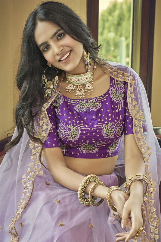 Engaging Lavender Color Net Fabric Lehenga With Embroidered Work