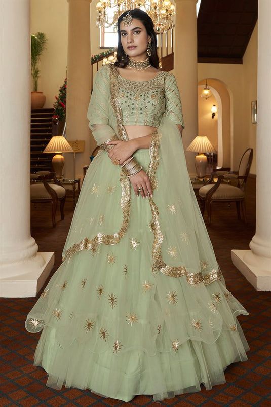 Net Fabric Sea Green Color Sangeet Wear Winsome Lehenga