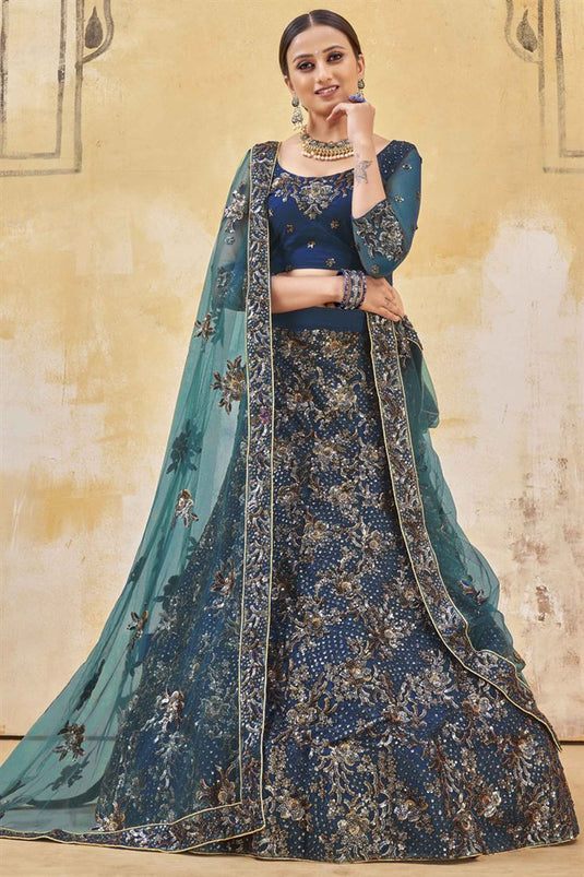 Sangeet Wear Net Fabric Embroidered Work Lehenga In Teal Color
