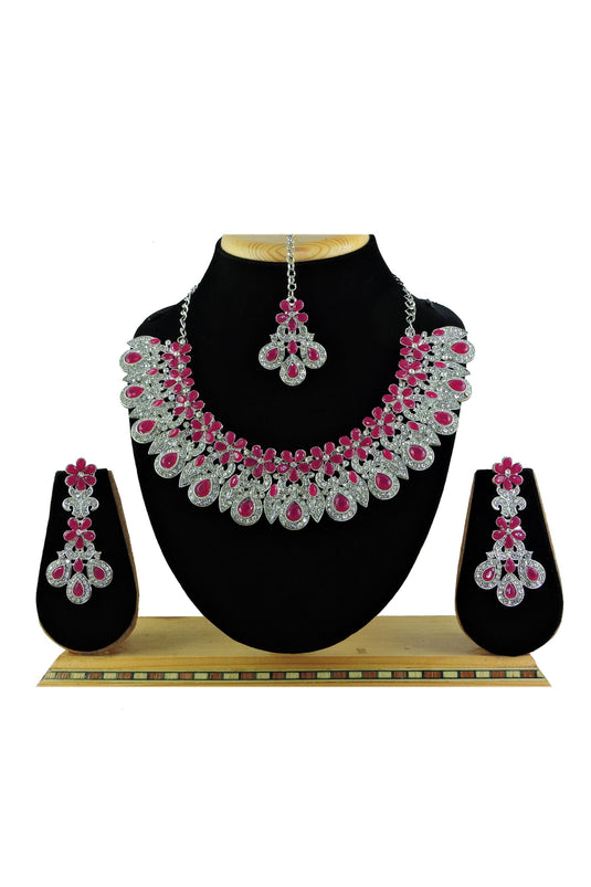 Graceful Alloy Necklace with Earrings and Mang Tikka In Rani Color