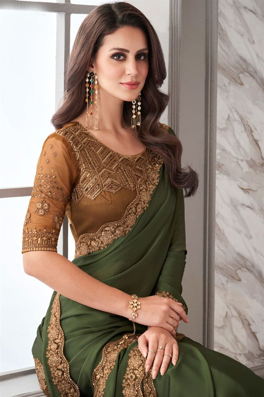 Larissa Bonesi Georgette Fabric Green Color Saree With Brilliant Border Work