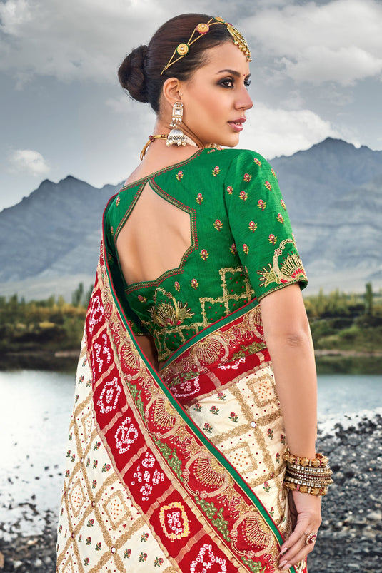 Appealing Pure Gajji Bandhani Satin Cream Color Saree With Heavy Embroidered Silk Blouse