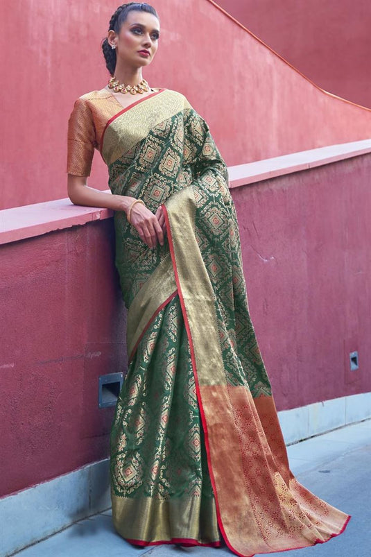 Dark Green Color Puja Wear Trendy Patola Art Silk Fabric Weaving Work Saree