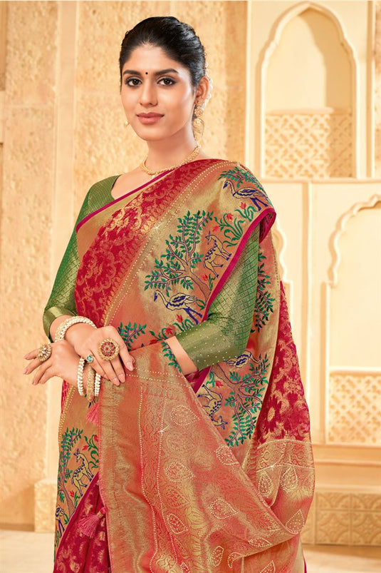 Tempting Organza Rani Color Saree With Weaving Work