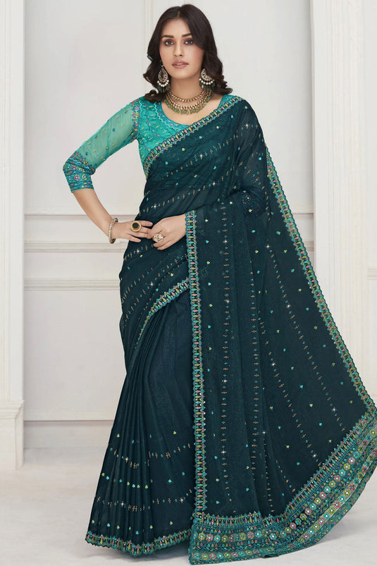 Excellent Chiffon Fabric Teal Color Saree With Embroidered Work