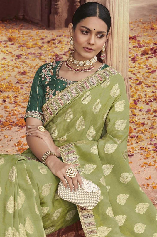 Engaging Olive Color Tissue Silk Saree With Embroidered Work