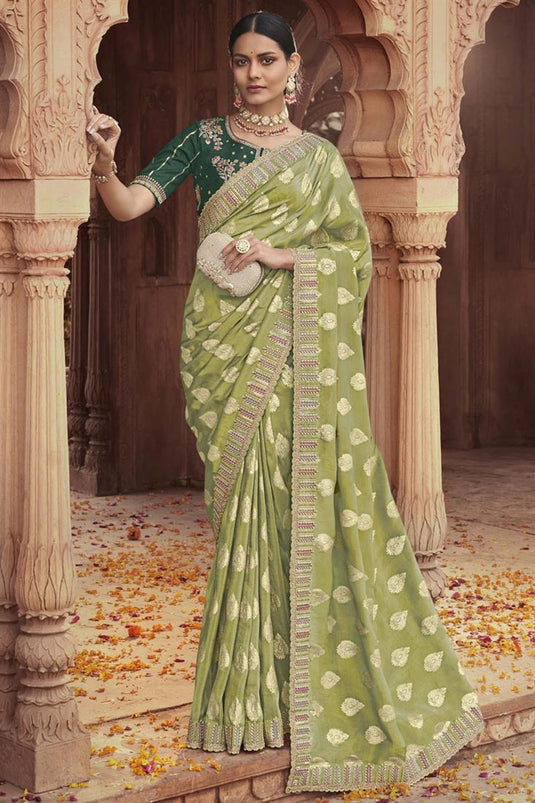 Engaging Olive Color Tissue Silk Saree With Embroidered Work