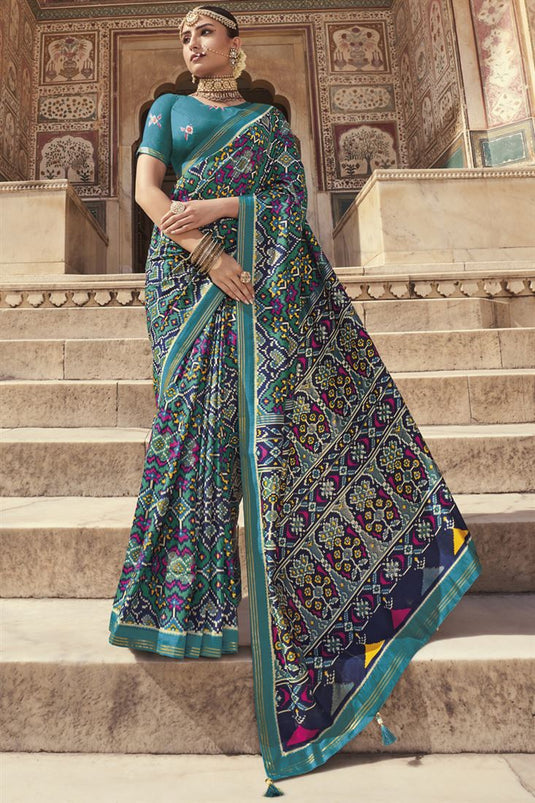 Teal Color Engrossing Printed Saree In Patola Silk Fabric
