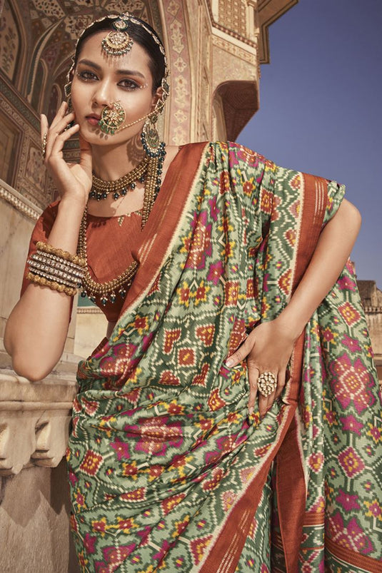 Sea Green Color Enthralling Printed Saree In Patola Silk Fabric