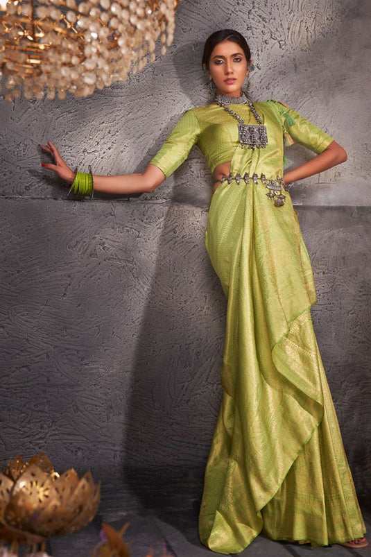 Riveting Weaving Work On Kanjivaram Silk Saree In Green Color