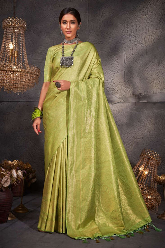 Riveting Weaving Work On Kanjivaram Silk Saree In Green Color
