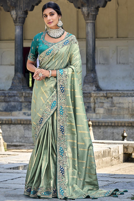 Beguiling Sea Green Color Silk Saree With Heavy Embroidered Blouse