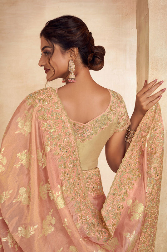 Embroidered Designs On Captivating Art Silk Fabric Saree In Peach Color