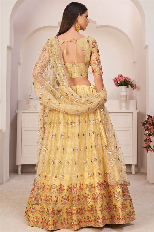Net Fabric With Embroidered Work Sangeet Wear Yellow Color Lehenga