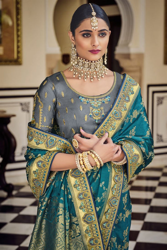 Elegant Wedding Wear Teal Color Banarasi Fabric Saree With Weaving Work
