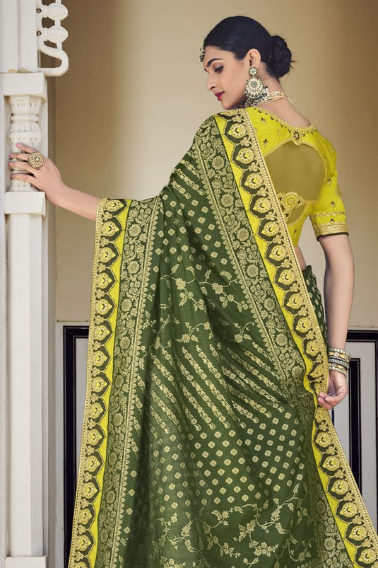 Banarasi Fabric Dark Green Color Wedding Wear Designer Saree With Weaving Work