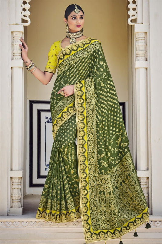 Banarasi Fabric Dark Green Color Wedding Wear Designer Saree With Weaving Work