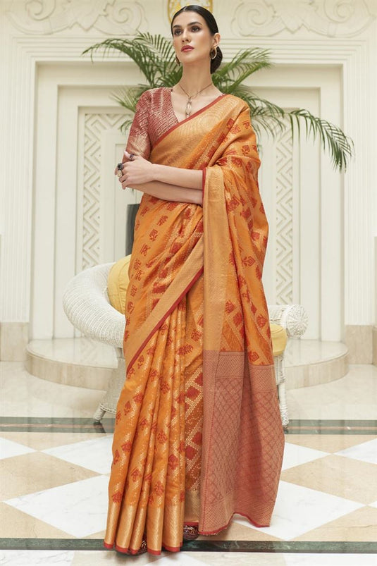 Patola Silk Fabric Tempting Festive Wear Orange Color Saree