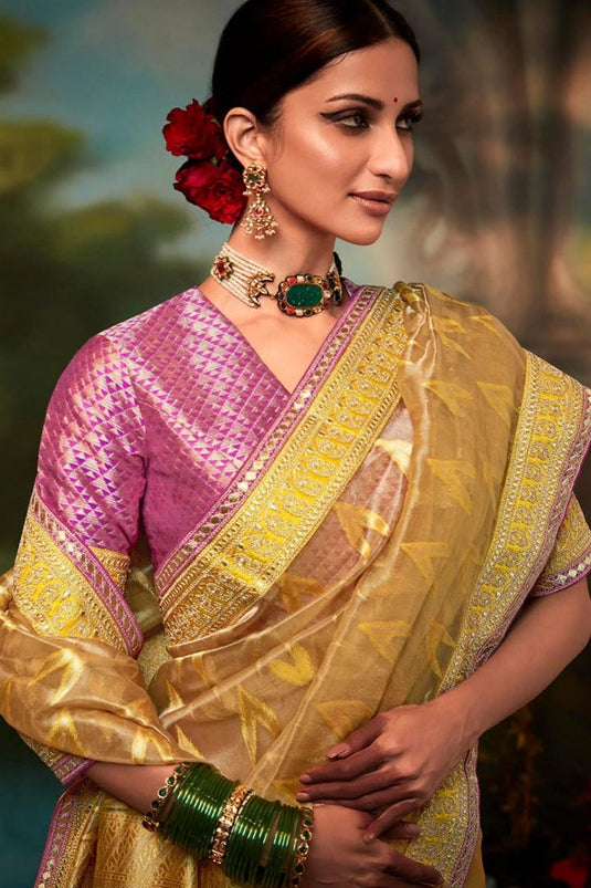Art Silk Fabric Intriguing Fancy Work Saree In Yellow Color