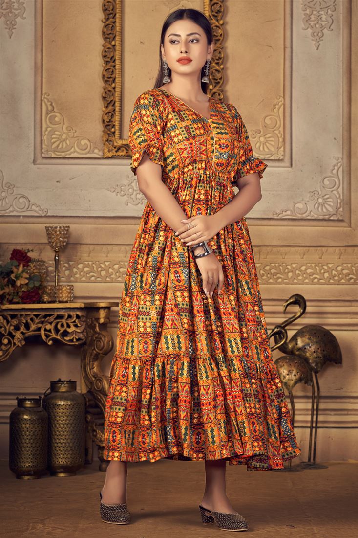 Image of A Beautiful evening scene at a Shopping Bazaar where a Staff is  seen dressing up a Mannequin with a traditional Indian Ladies Kurtis dress  at Mysuru,India.-ON918477-Picxy