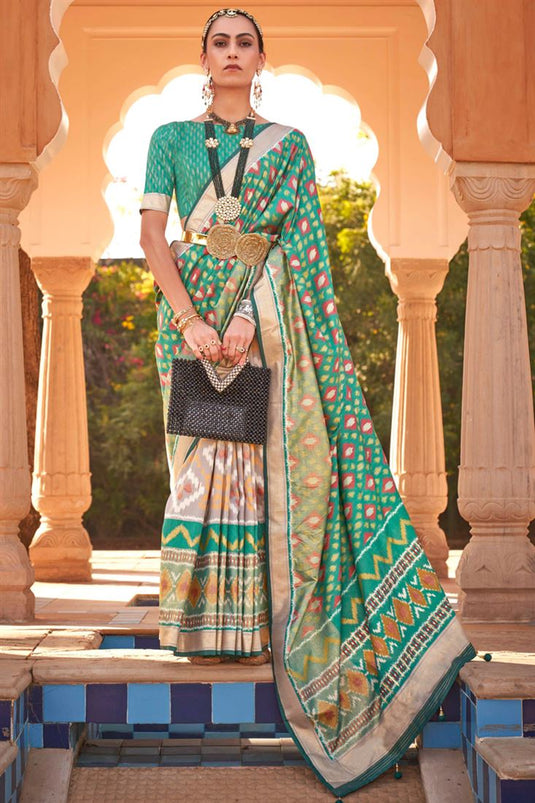 Printed Patola Silk Fabric Sea Green Color Festive Wear Fancy Saree